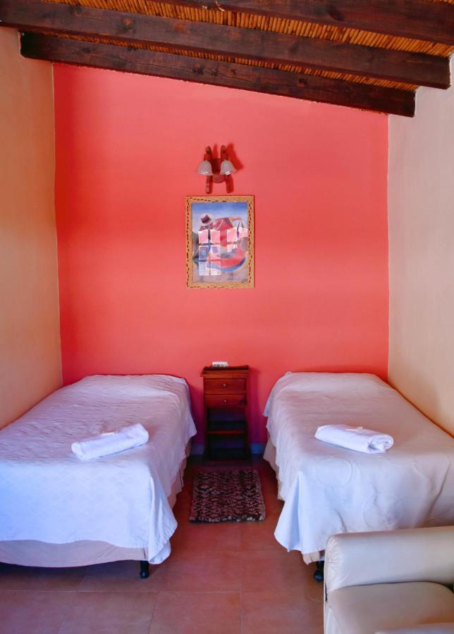 Hostal Paseo De Los Colorados 普尔马马尔卡 外观 照片